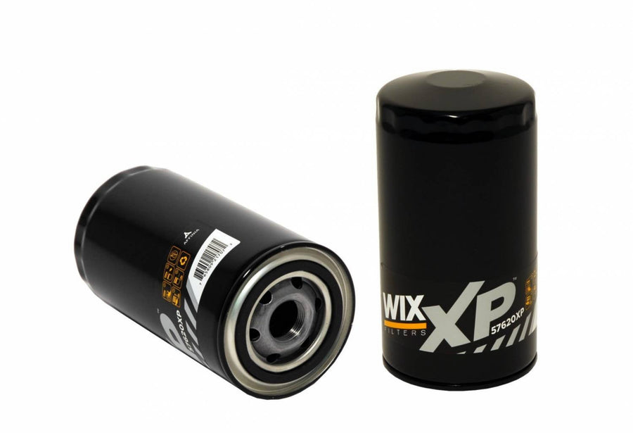 Two black Wix XP 5W30 oil filters, one standing upright and the other lying on its side, shown against a plain white background.